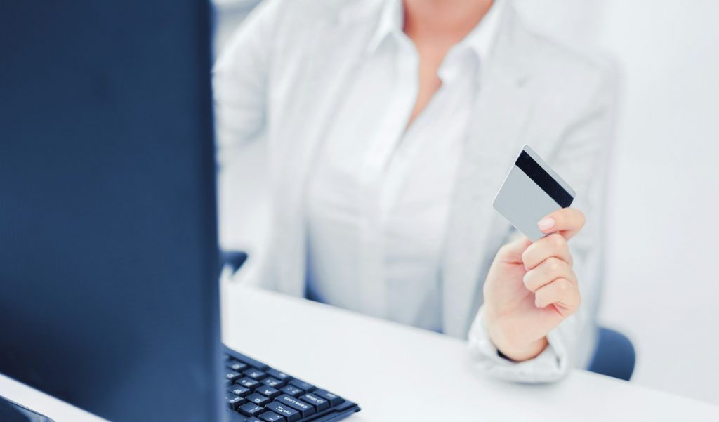 businesswoman with laptop and credit card